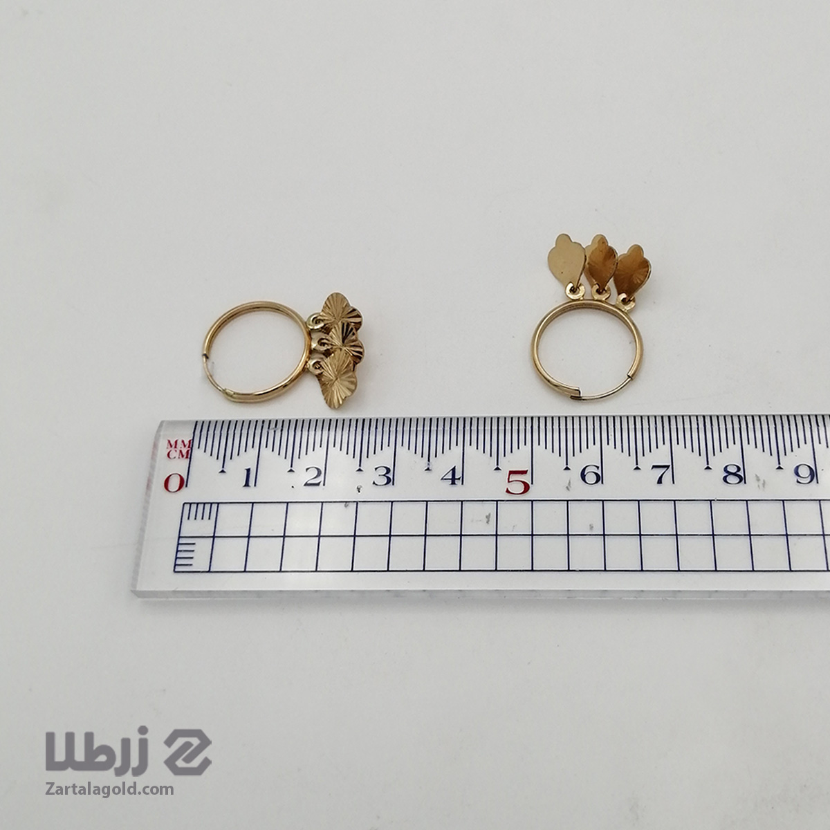 گوشواره حلقه ای طرح آویز گل گوشواره حلقه ای طرح آویز گل کد E18698