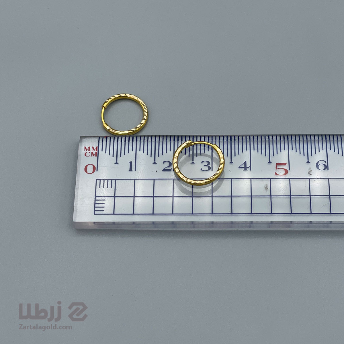 گوشواره حلقه ای طلا تراشدار سایز ریز گوشواره حلقه ای طلا تراشدار سایز ریز